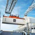 Reefer container being moved by a crane