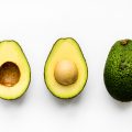 Macro shot of avocado isolated on white background