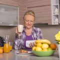 A shallow focus shot of a grandmother looking at the smartphone